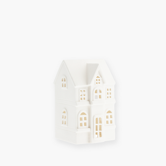 Byn nr 3 ceramic house by Storefactory, handmade matte ceramic decoration in white, 10x9x15 cm. Part of the Byn series to create Scandinavian ceramic villages with battery-operated lights, ideal for Christmas or Nordic interior styling.